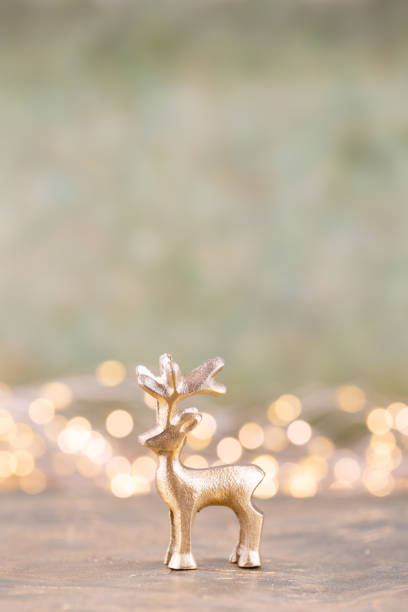 istock Christmas reindeer on bokeh silver background. Christmas or New Year minimal concept. 1176314342