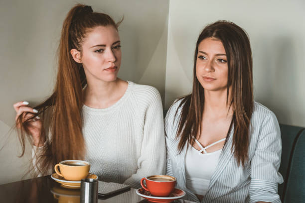 istock Young Female Friends is Having a Coffee Break 1176315987