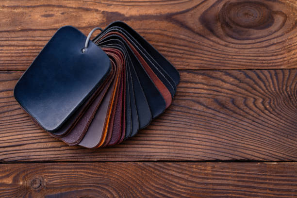 istock Leather samples for shoes on dark wooden table. 1176316099