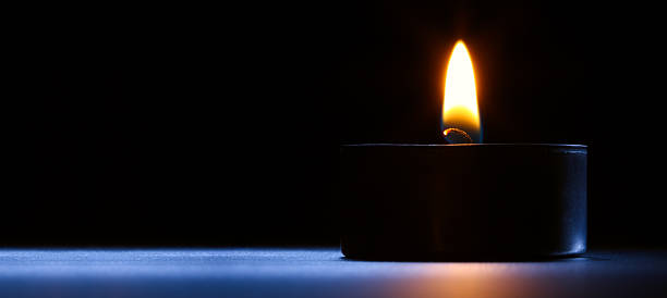 istock Candle on the desk. Black-blue background. 117631612