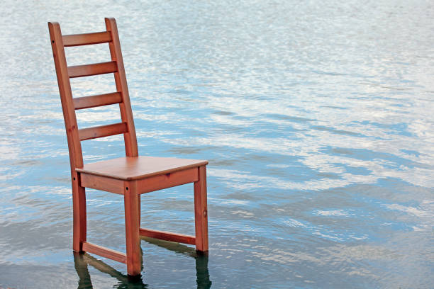 istock wooden chair wave river background 1176320119