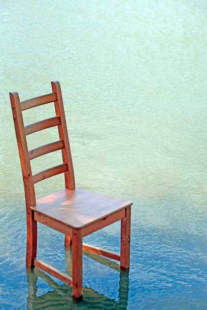 istock wooden chair wave river background 1176320120