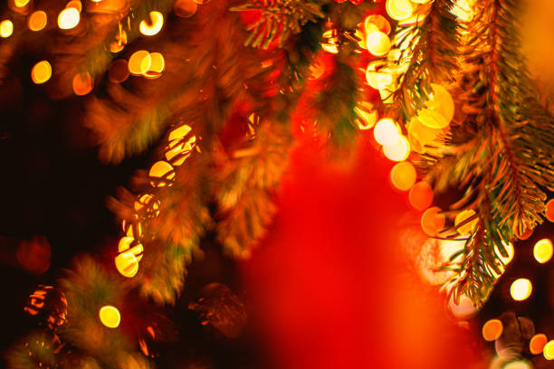 istock Decorated Christmas tree on blurred background with abstract  golden bokeh lights. Beautiful Merry Christmas and Happy New Year Fairy Card 1176320173