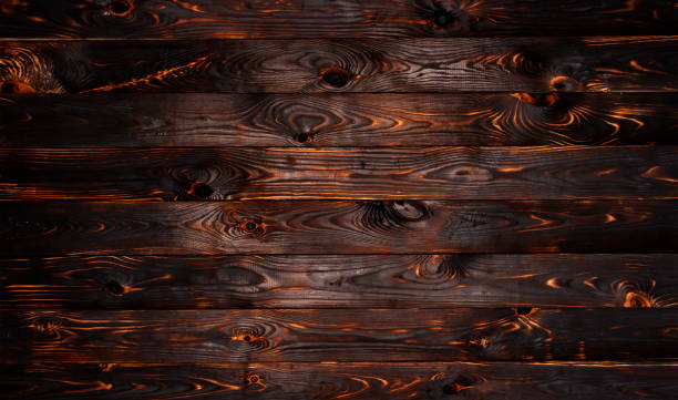Burnt wooden board, black charcoal wood texture, burned barbecue background Burnt wooden board, black charcoal wood texture, burned coal barbecue background with copy space, top view lava photos stock pictures, royalty-free photos & images