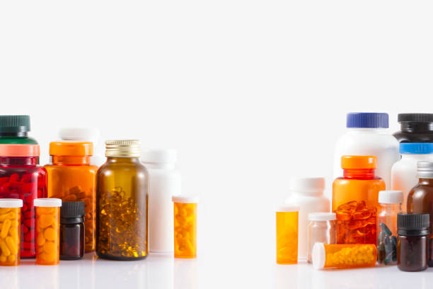 bottiglie di pillole - vitamin e cod liver oil vitamin pill capsule foto e immagini stock