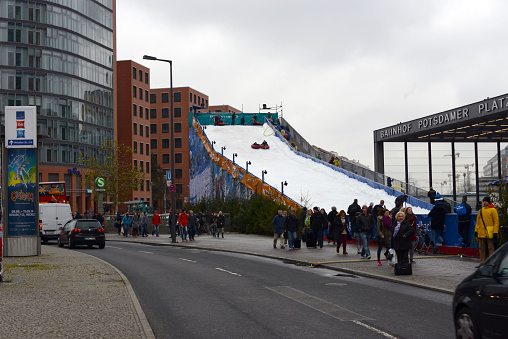 Berlin, Germany, 11/23/2013\nartificial ski slope for tubing at Christmas fair in Berlin, Potsdamer Platz