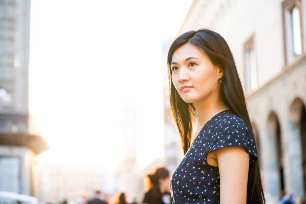 istock Smiling Chinese tourist girl 1176325896