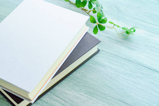 istock Books on a wooden table (Blank cover book on wooden background) 1176326181