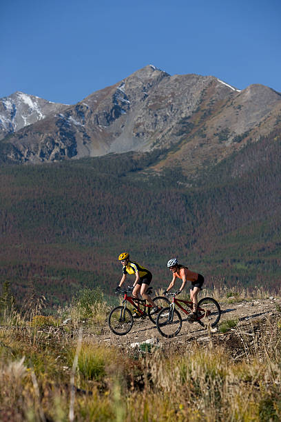 istock Two People Riding Bicyles in the Rocky Mountains 117632642