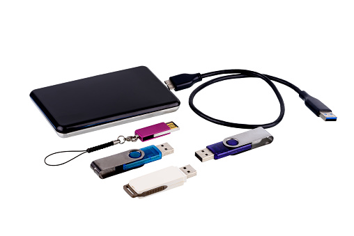Group of Portable usb memory or USB flash drive and External 2.5'' hard drive HDD with USB Cable port isolated on white background with clipping path