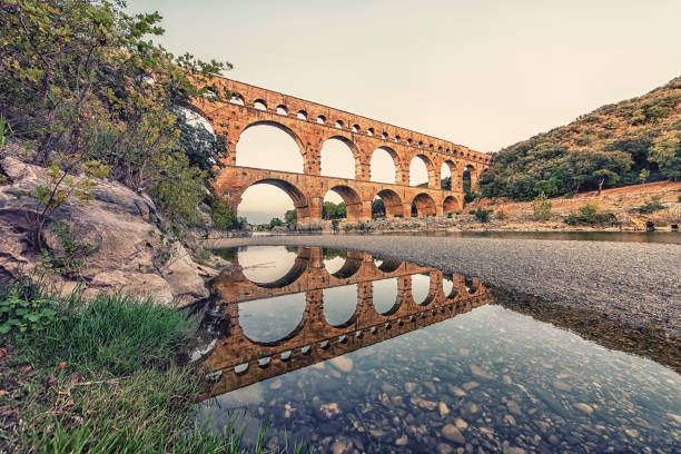 Roman bridge in France Pont du Gard in France, an UNESCO world heritage site famous sight stock pictures, royalty-free photos & images