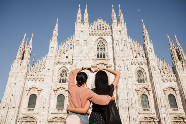 istock happy girlfriends look at the duomo 1176328716