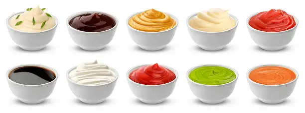 Collection of different sauces isolated on white background with clipping path, ketchup, sour cream and mustard in ceramic gravy boat, japanese soy sauce, mayonnaise and barbecue dressing