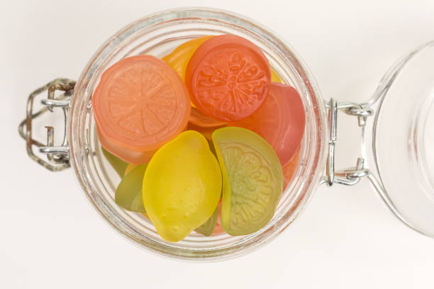 gummy candy of lemon, lime, orange and grapefruit in a glass jar