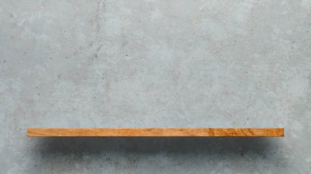istock Wooden shelf over white concrete wall background 1176334528
