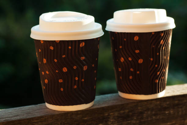 istock Two corrugated coffee cups on a wooden balcony. Hot drinks to go. 1176336326