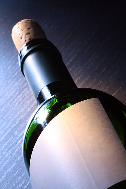 Champagne bottle on black background, copy space. close up.