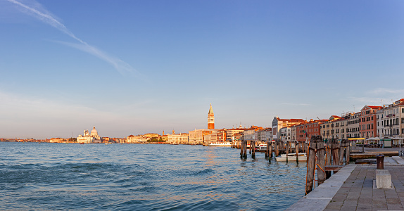 Venice.  Panoramic view of San Marco basin at sunrise during golden hour seen from Riva San Biasio. Panoramic view (12 shots stitched)