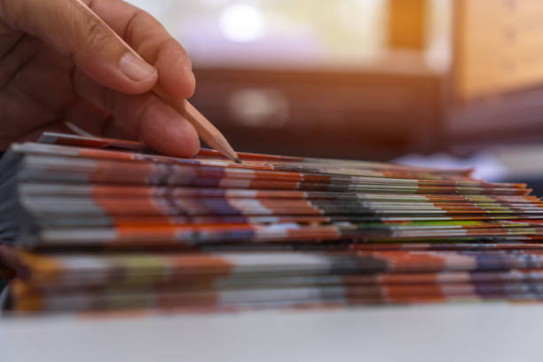 istock Business Documents concept : Businessman hands working in Stacks Brochures paper files for checking document achieves reports on busy work desk office 1176339559
