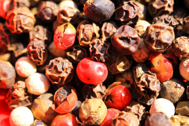 istock Macro close up of isolated pile with mixed peppercorns in bright sunlight 1176340668