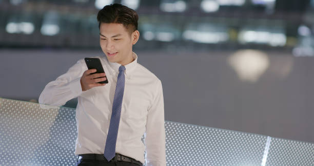 istock businessman use phone outdoor 1176349803