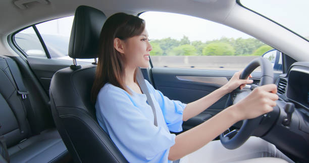 istock asian woman driving car 1176349833