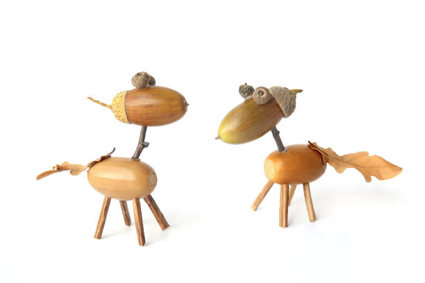 istock Cute small horses made from acorns isolated on white background. 1176352068