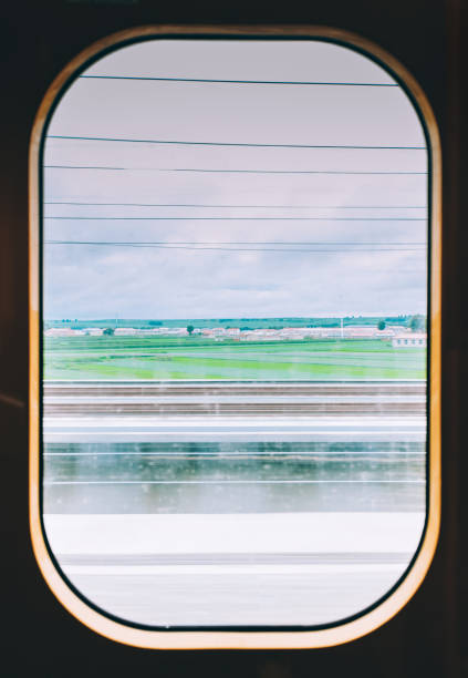 istock View from high speed train window in motion of countryside 1176352335