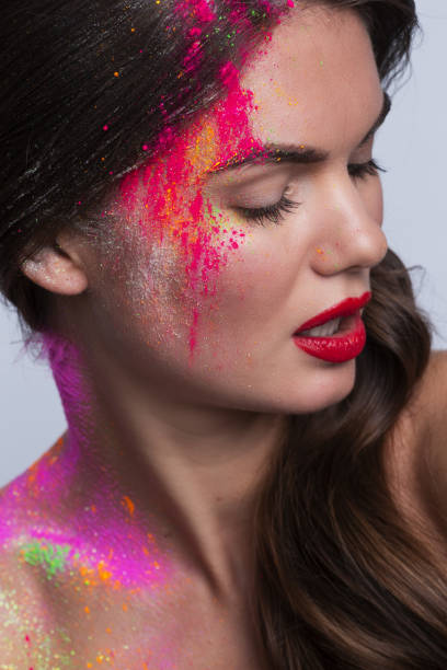 istock Woman face with colorful makeup 1176352770