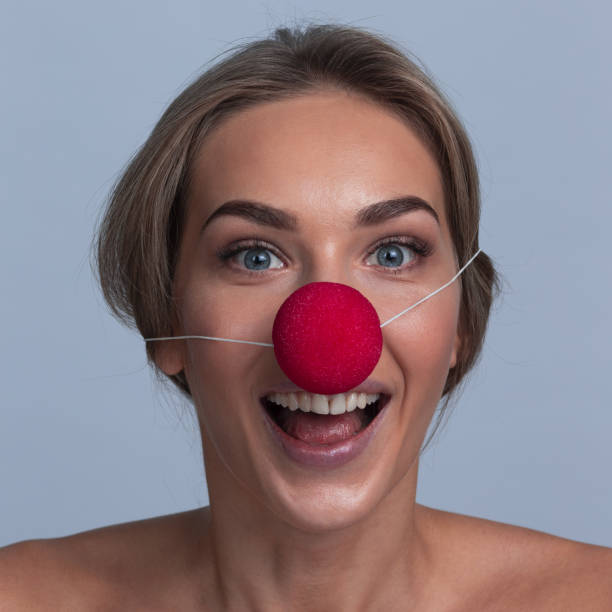 istock Happy young girl with a clown nose 1176352821