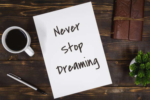 istock Paper with Inspirational Quote on Rustic Wood 1176354971