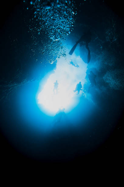 istock SCUBA Divers Sinking into Famous Blue Holes of Palau, Micronesia 1176356504