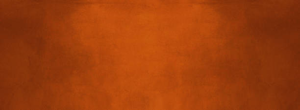 istock orange and dark cement texture wall banner background 1176356758