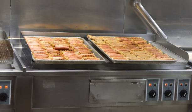 istock Trays of partially cooked sausages 1176356959