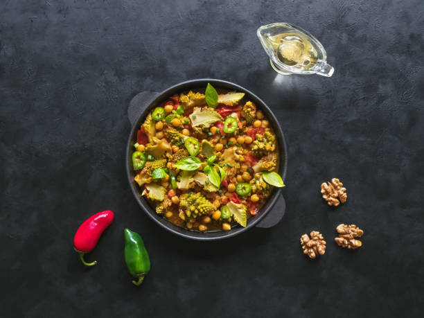 Nutty roasted romanesco curry in frying pan. Top view.