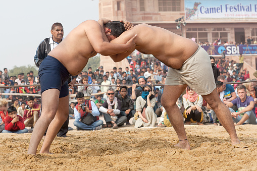 Bikaner, India - January 12, 2019: Indian wrestlers doing their practice during Camel festival in Rajasthan. Pehlwani, or kushti is a form of wrestling from the Indian subcontinent.