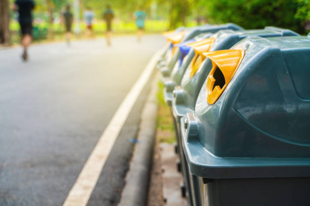istock Colorful plastic trash bin many type of garbage in green park 1176361117