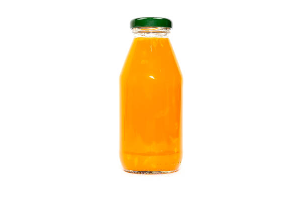 istock Orange juice in glass bottle Isolated on a white background. 1176362729