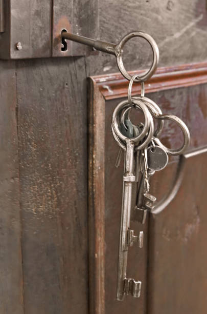 istock Medieval antique keys in a old door lock 1176364270