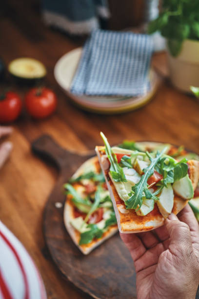 istock Vegan Avocado Pizza with Tomato and Arugula 1176364342
