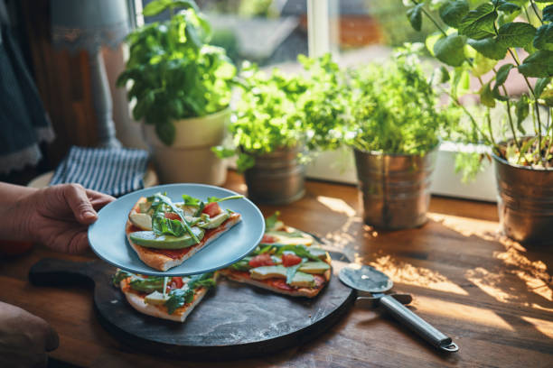 istock Vegan Avocado Pizza with Tomato and Arugula 1176364345