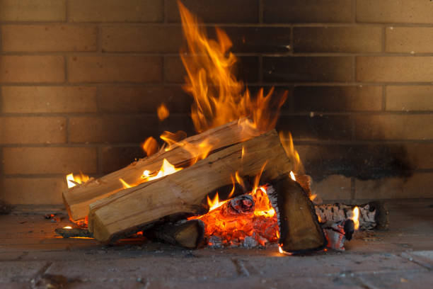 istock burning firewood in the fireplace. 1176365249