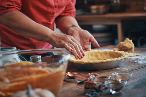 istock Preparing Pumpkin Pie for the Holidays in Domestic Kitchen 1176365485
