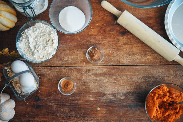 Preparing Pumpkin Pie for the Holidays in Domestic Kitchen