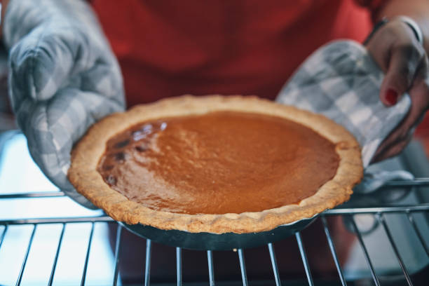 istock Baking Pumpkin Pie for the Holidays in the Oven 1176365495
