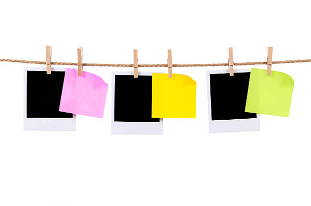 istock Blank photo prints and sticky notes on a rope 117636619