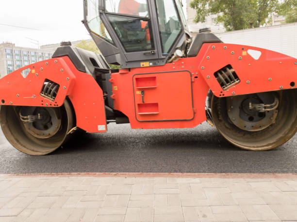 istock Road roller building the new asphalt road. Heavy asphalt roller that stack and press hot asphalt. Road repair machine. Repairing in modern city with vibration roller compactor 1176372388