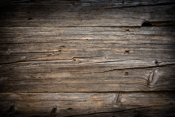 Backgrounds: old wooden plank with horizontal stripes Top view of a weathered wooden plank with horizontal stripes. Predominant color is brown. XXXL 42Mp studio photo taken with SONY A7rII and Zeiss Batis 40mm F2.0 CF boarded up photos stock pictures, royalty-free photos & images