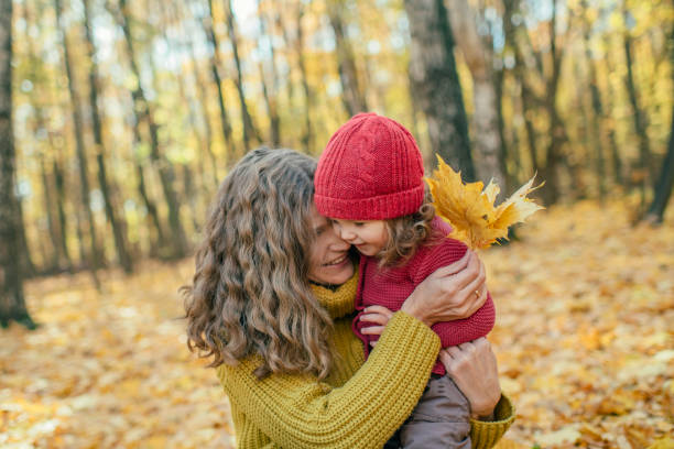 istock Family enjoying autumn in park 1176378280