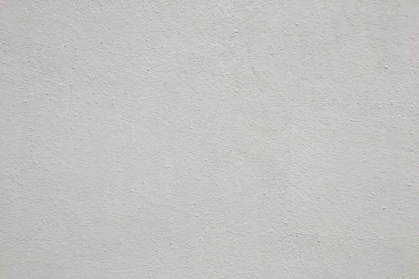 istock Abstract weathered texture stained old stucco light gray and aged paint white brick wall background in rural room. 1176381937